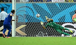 Costa Rica's goalkeeper Keylor Navas saves from Greece forward Fanis Gekas in the penalty shoot-out