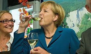 Angela Merkel drinks wine