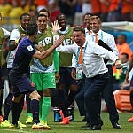 Robin Van Persie of Netherlands celebrates scoring his goal to make it 1-1 with manager Louis Van Gaal