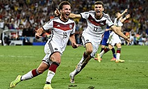 Germany's Mario Götze (left) celebrates with Thomas Muller after scoring the winning goal during ext